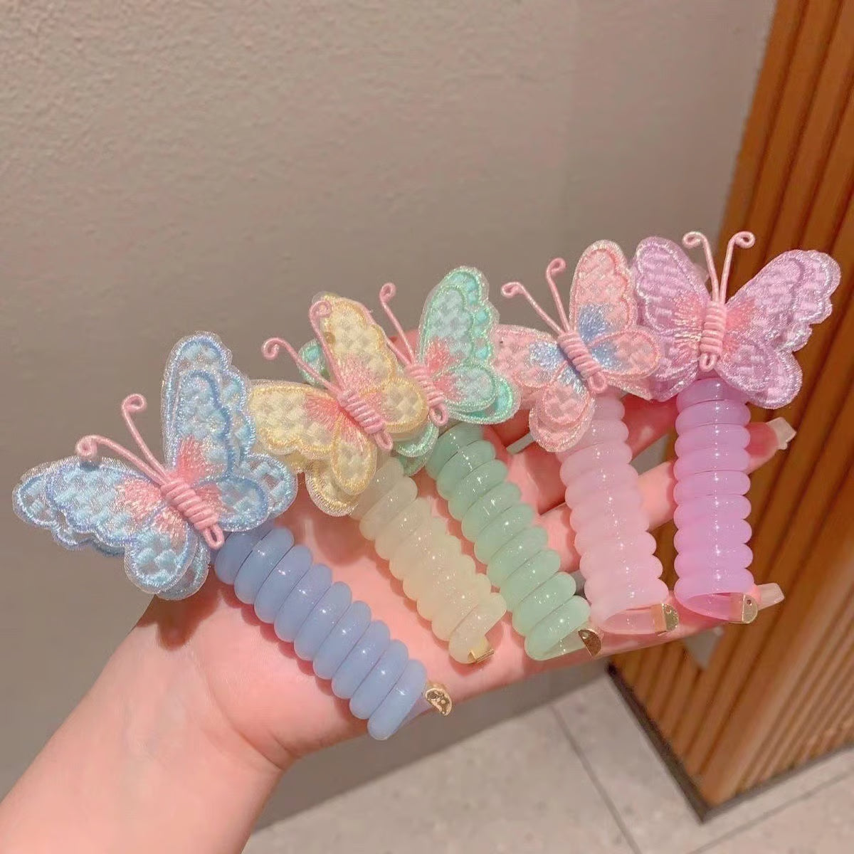 Butterfly Spiral Hair Tie ~ Turns boring ponytails into butterfly masterpieces.